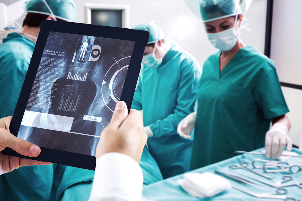 Man using tablet pc against medical interface on xray-1